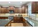 The kitchen has a stainless steel sink, tile backsplash, and modern appliances at 11187 Calypso Dr # 12, Alpharetta, GA 30009