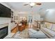 Bright and airy living space with fireplace, dining area, and open layout at 11187 Calypso Dr # 12, Alpharetta, GA 30009