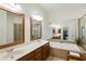 Elegant bathroom with a soaking tub, dual vanities, large mirrors, and glass shower at 11187 Calypso Dr # 12, Alpharetta, GA 30009