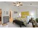 Spacious main bedroom featuring a vaulted ceiling, ceiling fan, and natural light from large windows at 11187 Calypso Dr # 12, Alpharetta, GA 30009