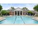 Beautiful community swimming pool with lounge chairs and a spacious deck area at 11187 Calypso Dr # 12, Alpharetta, GA 30009