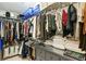 Walk-in closet with ample storage, multiple hanging racks, and built-in drawers at 11187 Calypso Dr # 12, Alpharetta, GA 30009