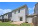 This cozy backyard features a small concrete patio, green lawn and a wood fence at 118 Woodhouse Cir, Acworth, GA 30102
