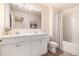 Bathroom featuring double sink vanity, shower with curtain, and neutral color palette at 118 Woodhouse Cir, Acworth, GA 30102