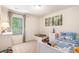 Cozy room featuring a twin bed, toys, and natural light from the window at 118 Woodhouse Cir, Acworth, GA 30102