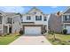 Charming two-story home featuring a two-car garage and a well-maintained front yard at 118 Woodhouse Cir, Acworth, GA 30102