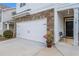 Welcoming home featuring stone accents, a two-car garage, and a cozy front porch at 118 Woodhouse Cir, Acworth, GA 30102