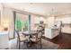 Bright eat-in kitchen featuring stainless steel appliances and hardwood floors at 118 Woodhouse Cir, Acworth, GA 30102