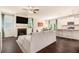 Open concept living room showcasing a fireplace and seamless flow to the kitchen area at 118 Woodhouse Cir, Acworth, GA 30102