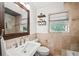 Neutral-toned bathroom features a vanity sink, toilet, and shower at 331 Lakemoore Ne Dr # C, Atlanta, GA 30342