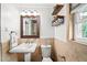 Neutral-toned bathroom features a vanity sink, toilet, and shower at 331 Lakemoore Ne Dr # C, Atlanta, GA 30342