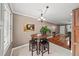 Bright breakfast nook with a quaint table, bar stools, and a window offering natural light at 331 Lakemoore Ne Dr # C, Atlanta, GA 30342
