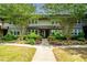 Charming townhome with lush landscaping, colorful flower beds, and mature trees at 331 Lakemoore Ne Dr # C, Atlanta, GA 30342