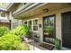 Charming front porch of townhome with mature plants, flowers and sitting area at 331 Lakemoore Ne Dr # C, Atlanta, GA 30342