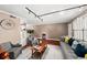 Inviting living room with hardwood floors, neutral paint, and a decorative wall clock at 331 Lakemoore Ne Dr # C, Atlanta, GA 30342