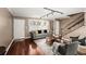 Cozy living room with a plush sofa, a warm color palette, hardwood floors and a bright window at 331 Lakemoore Ne Dr # C, Atlanta, GA 30342