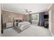 Spacious main bedroom with tan walls, ceiling fan, neutral carpet, and plentiful natural light at 331 Lakemoore Ne Dr # C, Atlanta, GA 30342