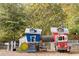 Whimsical playground featuring playhouses, a fire truck, and climbing structures, perfect for imaginative play at 331 Lakemoore Ne Dr # C, Atlanta, GA 30342
