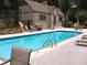 Community pool with lounge chairs and a pool house at 331 Lakemoore Ne Dr # C, Atlanta, GA 30342