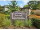 Lakemoore Colony townhome community entrance sign surrounded by manicured landscaping at 331 Lakemoore Ne Dr # C, Atlanta, GA 30342