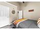 Comfortable bedroom with a soft color scheme and ample space with two doors, providing a tranquil retreat at 100 Lantana Dr, Locust Grove, GA 30248