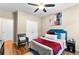 Bedroom showcasing a queen bed with cozy linens, complemented by a ceiling fan and closet at 100 Lantana Dr, Locust Grove, GA 30248