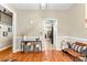 Dining room featuring hardwood floors, wainscoting, and designer furniture at 100 Lantana Dr, Locust Grove, GA 30248
