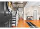 Welcoming entryway featuring hardwood floors and a staircase at 100 Lantana Dr, Locust Grove, GA 30248