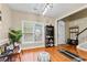 A welcoming foyer with hardwood floors, a stylish rug, and a view of the staircase at 100 Lantana Dr, Locust Grove, GA 30248