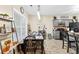 Kitchen features a dining area, gray cabinets, and modern black appliances at 100 Lantana Dr, Locust Grove, GA 30248