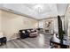 Living room with tray ceiling, modern floors, and lots of natural light at 100 Lantana Dr, Locust Grove, GA 30248