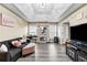 Comfortable living area featuring an accent wall and plenty of natural light at 100 Lantana Dr, Locust Grove, GA 30248