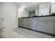 Sleek bathroom vanity with modern fixtures, ample storage, and a large mirror at 1076 Green St, Roswell, GA 30075
