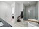 Open bathroom layout featuring a shower, bathtub, modern design, and bedroom entrance at 1076 Green St, Roswell, GA 30075