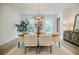 Elegant dining room featuring a modern chandelier, sleek table, and comfortable seating at 1076 Green St, Roswell, GA 30075