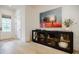 Inviting entryway with light wood floors, art, and a stylish console table, creating a warm welcome at 1076 Green St, Roswell, GA 30075