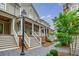 Charming townhomes feature covered porches and landscaped walkways for a welcoming curb appeal at 1076 Green St, Roswell, GA 30075