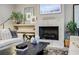Close-up of living room showcasing fireplace with a large mantle and decor at 1076 Green St, Roswell, GA 30075