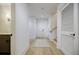 Bright hallway features wood floors and an area rug, leading to various rooms at 1076 Green St, Roswell, GA 30075