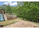 Backyard with a playground, swing set, and privacy fence, perfect for outdoor fun and relaxation at 1529 Shiloh Manor Ct, Marietta, GA 30066