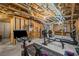 Unfinished basement area featuring exercise equipment and exposed beams, ready for customization at 1529 Shiloh Manor Ct, Marietta, GA 30066
