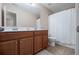 Bathroom featuring double sinks, a large mirror, and a shower providing a functional and spacious experience at 1529 Shiloh Manor Ct, Marietta, GA 30066