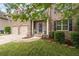 Charming brick home featuring a well-manicured lawn, two-car garage, and inviting front entrance at 1529 Shiloh Manor Ct, Marietta, GA 30066