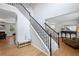 Bright and airy foyer with staircase and hardwood flooring, leading to a cozy living space at 1529 Shiloh Manor Ct, Marietta, GA 30066