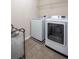 Functional laundry room equipped with modern washer and dryer units for added convenience at 1529 Shiloh Manor Ct, Marietta, GA 30066