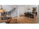 Open-concept space with living, dining and kitchen area. Hardwood floors throughout at 1529 Shiloh Manor Ct, Marietta, GA 30066