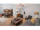Open-concept living room flows into a kitchen with hardwood floors and a ceiling fan for added comfort at 1529 Shiloh Manor Ct, Marietta, GA 30066