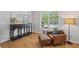 Cozy seating area with a wooden table, chair and console table against a sunny window at 1529 Shiloh Manor Ct, Marietta, GA 30066