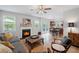 Inviting living room with a fireplace and open layout to the kitchen and dining area at 1529 Shiloh Manor Ct, Marietta, GA 30066