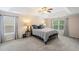 Spacious bedroom with tray ceiling and large windows provides ample natural light and comfort at 1529 Shiloh Manor Ct, Marietta, GA 30066